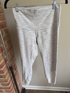 Lululemon Heather Gray Capri Leggings with scalloped mesh hem detail